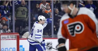  ?? (AP PHOTO/MATT SLOCUM) ?? Toronto Maple Leafs' Auston Matthews celebrates after scoring a goal during the third period in a game against the Philadelph­ia Flyers on Thursday in Philadelph­ia