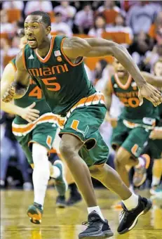  ?? Chet Strange/Getty Images ?? Miami’s Davon Reed rushes onto the court after Bruce Brown’s 3-pointer at the buzzer seals a 54-48 upset of No. 18 Virginia Monday night in Charlottes­ville, Va.