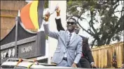  ?? Ronald Kabuubi Associated Press ?? UGANDAN pop star Kyagulanyi Ssentamu, a.k.a. Bobi Wine, celebrates being sworn in to Parliament.