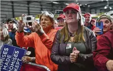  ?? Nicholas Kamm / Getty Images ?? Supporters of President Donald Trump listen as he speaks Saturday in Pensacola, Fla., a state he won in the 2016 election.