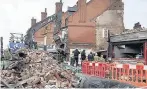  ?? AARON CHOWN ?? The scene of the explosion in Leicester