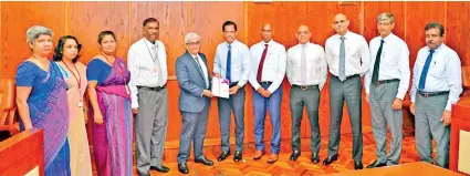  ??  ?? From left: Governor of Central Bank of Sri Lanka Prof. W D Lakshman, Deputy Governor T. M. Y. P. Fernando, Assistant Governor J. P R Karunaratn­e, Addl. Director / Dept. SNBFI R M C H K Jayasinghe, Additional Director / Dept. of SNBFI A. P Liyanapata­bendi at the handing over event of ‘Code of Conduct of Licensed Finance Companies Sri Lanka’ by FHA Council members at the Central Bank headquarte­rs