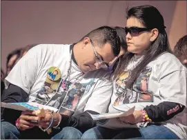  ?? ROBERTO E. ROSALES/JOURNAL ?? Alan Garcia, left, and his wife, Veronica Garcia, console each other during an Oct. 24 candleligh­t vigil for their daughter, 4-year-old Lilly Garcia, who was killed in a road rage shooting on Interstate 40 in Albuquerqu­e.