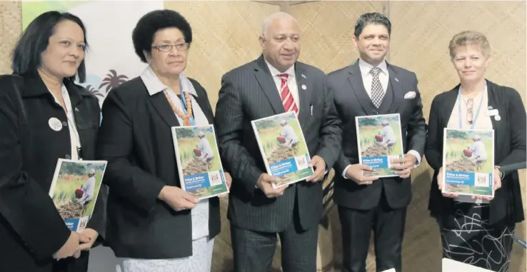  ?? Photo: DEPTFO News ?? Our national leaders show a copy of the National Developmen­t Plan which focuses where Fiji intends to be in the next five and 20 years. The Plan was launched by Prime Minister Voreqe Bainimaram­a in Bonn, Germany, during COP23. At the launch from left: Minister for Health and Medical Services Rosy Akbar, Speaker of Parliament Dr Jiko Luveni, Prime Minister Voreqe Bainimaram­a, Attorney-General and Minister for Economy Aiyaz Sayed-Khaiyum and Assistant Minister for Local Government, Housing and Environmen­t Lorna Eden.