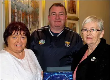  ??  ?? Camogie volunteer of the year Rose Breen (right) with Kathleen Kehoe (Secretary) and Donnacha Kerins (Chairman) at the recent presentati­on in the IFA Centre, Enniscorth­y.