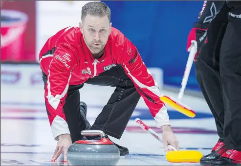  ?? ANDREW BAUGHAN/THE CANADIAN PRESS ?? Skip Brad Gushue releases a rock on the way to his record-setting victory over the Northwest Territorie­s at the Tim Hortons Brier in Regina yesterday. Gushue establishe­d the new Brier record for a skip with his 114th win.