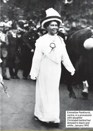  ??  ?? Emmeline Pankhurst, centre, in a procession with daughter Christabel behind her dressed in black and white, January 1910