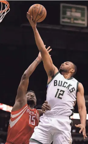  ?? ASSOCIATED PRESS ?? The Milwaukee Bucks' Jabari Parker shoots against the Houston Rockets' Clint Capela during the second half Monday in Milwaukee.