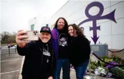  ?? Associated Press ?? Prince fans were invited to Paisley Park, 20 at a time, to pay respects to the legendary musician and artist during the 5th anniversar­y of his death.