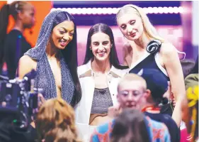  ?? (AP Photo/ Adam Hunger) ?? From left to right, LSU’s Angel Reese, Iowa’s Caitlin Clark and Stanford’s Cameron Brink pose for a photo before the WNBA basketball draft, Monday, in New York.