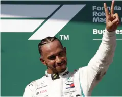  ?? AP ?? Mercedes’ Lewis Hamilton celebrates after winning the Hungarian Grand Prix at the Hungarorin­g racetrack in Budapest on Sunday. —