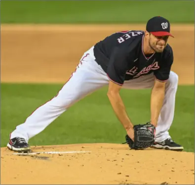  ?? File photo ?? Washington Nationals Max Scherzer, above, said the implementa­tion of the universal DH has taken away the joy of grinding away in the batting cage to get better.