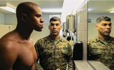  ?? Patti Perret/A24 Films ?? Jeremy Pope (left) plays Ellis French and Raúl Castillo plays Rosales, a drill sergeant, in “The Inspection.” Pope’s role is based on the real-life experience­s of Elegance Bratton during the “don’t ask, don’t tell” era.