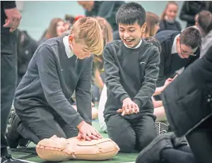  ?? Picture: Mhairi Edwards. ?? Perth High School pupils, Cameron Craik, 14 and Myles Woodside, 12, doing CPR training.