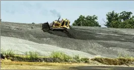  ?? BOB ANDRES/AJC FILE ?? Some of Georgia Power’s coal ash is being given a second life in concrete mixes. But there are environmen­tal concerns about the ash at some sites.