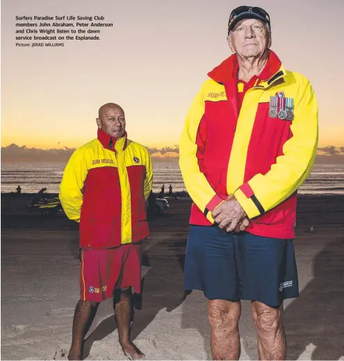  ?? Picture: JERAD WILLIAMS ?? Surfers Paradise Surf Life Saving Club members John Abraham, Peter Anderson and Chris Wright listen to the dawn service broadcast on the Esplanade.