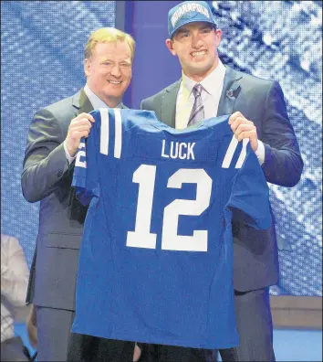  ?? FRANK FRANKLIN II/AP ?? Andrew Luck, right, poses for photograph­s with NFL Commission­er Roger Goodell after he was selected as the first pick overall by the Colts in the NFL draft on April 26, 2012.
OTHER APRIL 26 MOMENTS
1905: Jack McCarthy of the Cubs became the only outfielder in major league history to throw out three runners at the plate, each of whom became the second out of a double play. The victims were the Pittsburgh Pirates in a 2-1 loss.
1950: The University of Miami ends the longest winning streak in collegiate tennis by defeating William & Mary 8-1. William & Mary, unbeaten in five years, had won 82 consecutiv­e meets.
1995: The Rockies post an 11-9 victory over the Mets in 14 innings, tying the NL record for innings played in a season opener.
2002: Odalis Perez of Los Angeles faces the minimum 27 batters in his first career shutout. Perez was perfect for six innings in a 10-0 win over the Cubs at Chicago’s Wrigley Field.
2012: The Bobcats finish with the worst winning percentage in NBA history after a 104-84 loss to the Knicks. The Bobcats’ 23rd consecutiv­e loss leaves them with a winning percentage of .106 (7-59) in the lockout-shortened season. The record was set 39 years ago, when the 1972-73 76ers finished 9-73 (.110) in a full regular season.