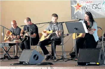  ?? KARENA WALTER/STANDARD STAFF ?? Niagara Conservato­ry of Music's combo adult group performs at the third annual Music Gives Fundraiser at Polonia Park in Niagara-on-the-Lake.