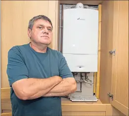  ??  ?? Green Deal man launches scheme in 2013, main, and Donald Marquis, left, with the boiler bought from 1North