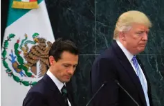  ?? (Xinhua/Sipa USA/TNS) ?? DONALD TRUMP, right, at a joint news conference with Mexican President Enrique Pena Nieto after their meeting last year in Mexico City.