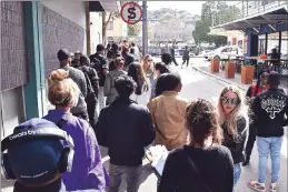  ?? PICTURE: JASON BOUD ?? Throngs of people queue outside and across the road from 107 Bree Street, a ‘Pablo’ pop-up store by US rapper, Kanye West. The pop-up store, open from 10am to 10pm, will close tomorrow.