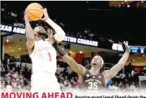  ?? PHOTO BY GEORGE WALKER 4TH/AP ?? MOVING AHEAD
Houston guard Jamal Shead shoots the ball past Texas A&M guard Manny Obaseki during the first half of a secondroun­d college basketball game in the NCAA Tournament, Sunday, March 24, 2024, in Memphis, Tennessee.