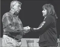  ?? SUBMITTED PHOTO/MARY MACPHERSON ?? Bruce Cathcart as Bill and Anita Danyluk as Donna, share a tender moment in the Cape Breton University Boardmore Theatre’s production of “Home and Away: A Hockey Musical” running from Tuesday, Feb. 20 to Sunday, Feb. 25.