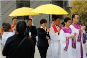  ?? AP Photo/Andy Wong ?? ■ Priests and their followers perform a procession during a Good Friday service at the Mindong undergroun­d Catholic church Friday in Saiqi in southeast China’s Fujian province. The parish’s bishop, Guo Xijin, was whisked away by the government the day...