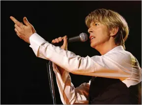  ?? BERTRAND GUAY/AFP VIA GETTY IMAGES ?? British singer David Bowie performs in July 2002 in Paris. He died in January 2016, but his legacy lives on.
