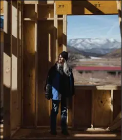  ?? ?? Jane Lumsden at the site of her new home in Cañoncito de las Manuelitas, New Mexico. The house is partially constructe­d from timber salvaged after the fire.
(Photo by Adria Malcolm / ProPublica)