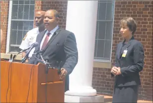  ?? STAFF PHOTO BY JAMIE ANFENSON-COMEAU ?? Tony Covington, state’s attorney for Charles County, front, gave a press conference Monday afternoon to announce 119 charges against Carlos Bell, a former Benjamin Stoddert Middle School instructio­nal assistant accused of sexually abusing 24 children....