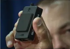  ?? AP PHOTO/ BEBETO MATTHEWS, FILE ?? In this Jan. 30, 2018 file photo, a newly issued police body camera is shown during a NYPD news conference in New York.