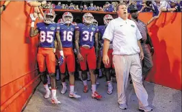  ?? ROB FOLDY / GETTY IMAGES ?? Coach Jim McElwain and the Florida Gators will try to bounce back from a 38-28 loss to Tennessee when they play at Vanderbilt at noon today. The Gators have recent history of struggling in games that kick off early in the day.