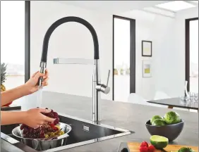  ??  ?? For homeowners who enjoy crafting delectable meals for family and friends, an upgrade to the Grohe Essence semi-pro faucet provides the perfect combinatio­n of modern functional­ity and high style.