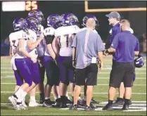  ?? The Sentinel-Record/Grace Brown ?? QUICK CHAT: Fountain Lake head coach Kenny Shelton, second from right, talks with his players during a timeout in their Sept. 13 game at Lakeside’s Chick Austin Field. The Cobras host the Joe T. Robinson Senators tonight at 7 p.m. at Allen Tillery Field.