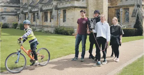  ??  ?? Sam and Ned with Oundle School Community Action pupils.