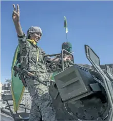  ?? GABRIEL CHAIM/THE ASSOCIATED PRESS ?? Fighters from the Women’s Protection Units hold a celebratio­n in Paradise Square in Raqqa, Syria, on Thursday. The Kurdish female militia that took part in freeing Raqqa from Islamic State said it will continue the fight to liberate women from the...