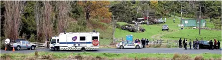  ??  ?? Kinohaku locals gathered yesterday after three bodies were discovered at the rural property.