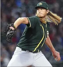  ?? PHOTO BY JOHN MEDINA ?? A.J. Puk delivers a pitch in the first inning of the A’s spring opener Saturday against the Cubs. He did not allow a run in his inning.