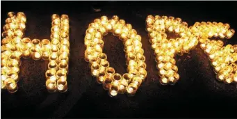  ??  ?? Candles spelling the word ‘Hope’ at Darkness Into Light. Pic: Sportsfile.