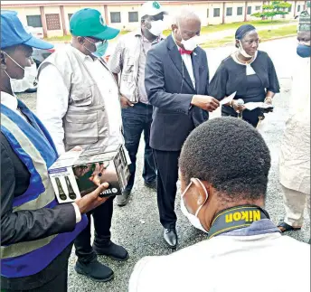  ??  ?? Chief Medical Director ( CMD) of University of Ilorin Teaching Hospital ( UITH), Prof. Abdullah Dasliva Yussuf ( middle) receiving a list of multi- million naira assorted medical equipment donated to the hospital by Emeka Offor Foundation in collaborat­ion with Savannah Centre for Diplomacy, Democracy and Developmen­t.