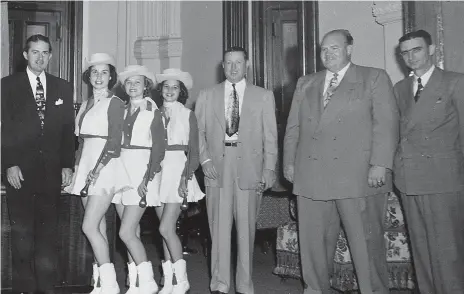  ?? Submitted photo ?? ■ Texas Gov. Alan Shivers, left, honors Howard Carney, third from right, as Carney stands next to Atlanta High School band director Tom Lavin and Sen. A.M. Aikin Jr. of Paris, Texas. The Atlanta High School Band majorettes were part of the of the celebratio­n ceremony.