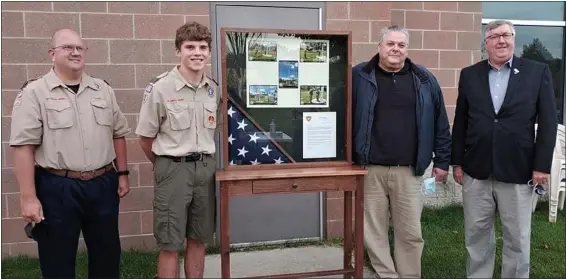  ?? PHOTO COURTESY OF MIKE SCOTT ?? Cameron Korman, member of Boy Scout Troop 1710, made a glass and wood American flag display case, which he donated to the Michigan Freedom Center at Detroit Metro Airport.