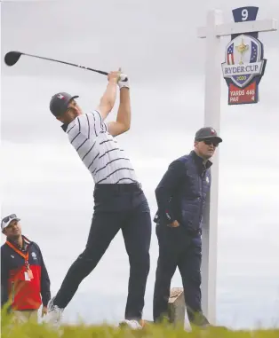  ?? JONATHAN ERNST/REUTERS ?? Team USA'S Jordan Spieth, seen hitting off the tee during Tuesday's practice round, says there's a sense of camaraderi­e among the young Americans.