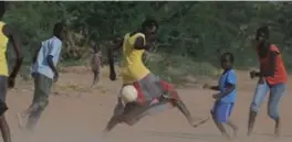  ??  ?? A girl’s soccer team practises on the outskirts of the Dadaab refugee camp. The camp is now home to 6,000 grandchild­ren of the original refugees.