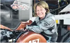  ??  ?? Life begins at 140kmh . . . Lynne Herring (57) from Tauranga, took up sidecar racing four years ago as an antidote to growing old. She was having a great time at the races yesterday.