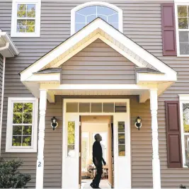  ?? AP PHOTO/JOHN MINCHILLO, FILE ?? A homeowner tours their new home in Washington­ville, New York, in July 2020. Experience­d agents are all too familiar with the misconcept­ions people have about insurance. For example, many don’t realize that a homeowners policy won’t cover damage from flooding, earthquake­s or everyday wear and tear.