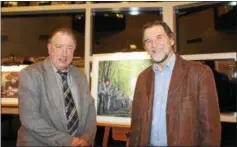  ?? SUBMITTED PHOTO ?? Immaculata University Professor Bill Watson poses with artist Fred Danziger and the artist’s paintings of Duffy’s Cut.