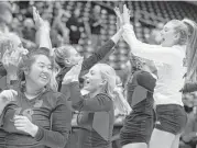  ?? Jason Fochtman / Conroe Courier ?? Seven Lakes players celebrate defeating San Antonio Northside O’Connor and advancing to the Class 6A final of the state volleyball tournament at Garland.