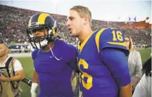  ?? John McCoy / Getty Images ?? Quarterbac­k Jared Goff (16) and defensive end Aaron Donald played big roles in the Rams’ win over the Seahawks in L.A.